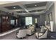 Community lounge with comfortable seating, a large TV, and stylish decor at 11901 Castine St, New Port Richey, FL 34654