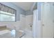 Bathroom showcasing a shower and tub combination, with a neutral color scheme at 12033 82Nd Ave, Seminole, FL 33772