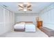 Bright bedroom with fan, closet, window, and ample lighting at 12033 82Nd Ave, Seminole, FL 33772