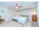Bedroom with two beds, closet, ceiling fan, carpeted floor, and natural light at 12033 82Nd Ave, Seminole, FL 33772