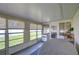 Enclosed back patio offering an abundance of natural light through many windows, creating a bright and inviting space at 12033 82Nd Ave, Seminole, FL 33772