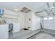 Spacious garage area featuring laundry machines, shelving, and plenty of storage space at 12033 82Nd Ave, Seminole, FL 33772