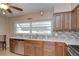 Kitchen featuring stainless steel appliances, double basin sink, and neutral countertops at 12033 82Nd Ave, Seminole, FL 33772