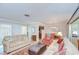 Cozy living area flows into the dining space, offering a comfortable and versatile living arrangement at 12033 82Nd Ave, Seminole, FL 33772