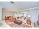 Inviting living room features hardwood floors, a neutral color palette, and a comfortable layout ideal for relaxation at 12033 82Nd Ave, Seminole, FL 33772