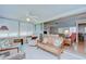 Inviting living room showcasing comfortable seating, tile flooring, and seamless access to adjacent living spaces at 12033 82Nd Ave, Seminole, FL 33772
