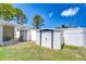 Backyard shed and covered patio for outdoor storage and relaxation at 12033 82Nd Ave, Seminole, FL 33772