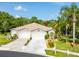 Charming single-story home featuring a well-manicured lawn and two-car garage at 12134 Tournament View Ave, New Port Richey, FL 34654