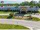 Commercial building with palm trees, American flag, and well-maintained landscaping at 12134 Tournament View Ave, New Port Richey, FL 34654