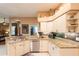 Kitchen area featuring stainless steel appliances, tile flooring, and granite counters at 12134 Tournament View Ave, New Port Richey, FL 34654