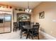 Eat-in kitchen featuring tile flooring, granite counters, stainless appliances and a dining area at 12134 Tournament View Ave, New Port Richey, FL 34654