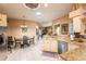 Spacious eat-in kitchen featuring stainless steel appliances, tile flooring, and granite counters at 12134 Tournament View Ave, New Port Richey, FL 34654