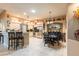 Bright kitchen with tile floors, granite counters, stainless appliances and a breakfast bar at 12134 Tournament View Ave, New Port Richey, FL 34654