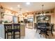 A stunning kitchen featuring stainless steel appliances, tile flooring, and lots of natural light at 12134 Tournament View Ave, New Port Richey, FL 34654