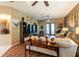 Cozy living room featuring ceiling fan, stylish decor, and comfortable seating at 12134 Tournament View Ave, New Port Richey, FL 34654
