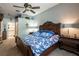 Comfortable main bedroom with ceiling fan, carpeted floors, and an en-suite bathroom at 12134 Tournament View Ave, New Port Richey, FL 34654