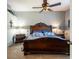 Spacious bedroom features a ceiling fan and views of an en-suite bathroom at 12134 Tournament View Ave, New Port Richey, FL 34654