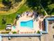 Overhead view of a unique pool design, spa, and lounge area at 12134 Tournament View Ave, New Port Richey, FL 34654