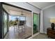 Open balcony overlooking the ocean, furnished with a high-top table and chairs at 1230 Gulf Blvd # 304, Clearwater, FL 33767