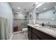 Bathroom with updated granite countertops and glass shower enclosure at 1230 Gulf Blvd # 304, Clearwater, FL 33767