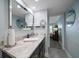Bathroom with granite counters, modern fixtures, and a view to the bedroom at 1230 Gulf Blvd # 304, Clearwater, FL 33767