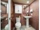 Unique bathroom features a brick wall and modern fixtures at 1230 Gulf Blvd # 304, Clearwater, FL 33767