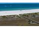 Beautiful beach scene with white sands, blue waters and a wooden boardwalk at 1230 Gulf Blvd # 304, Clearwater, FL 33767