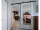 View of the kitchen and bedroom through a mirrored sliding door at 1230 Gulf Blvd # 304, Clearwater, FL 33767