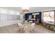 Brightly lit common area with seating, a table, and views of the beach at 1230 Gulf Blvd # 304, Clearwater, FL 33767