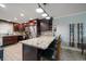 Kitchen with stainless appliances, granite counters, breakfast bar, and wine rack at 1230 Gulf Blvd # 304, Clearwater, FL 33767