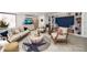 Comfortable living room with plush seating, TV, and charming coastal decor at 1230 Gulf Blvd # 304, Clearwater, FL 33767