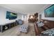 Open concept living room featuring modern furniture and seamless flow into the kitchen at 1230 Gulf Blvd # 304, Clearwater, FL 33767
