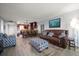 Open-concept living space with a kitchen island, cozy seating, and modern decor at 1230 Gulf Blvd # 304, Clearwater, FL 33767