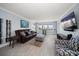 Comfortable living room with modern decor, large windows, and ample natural light at 1230 Gulf Blvd # 304, Clearwater, FL 33767