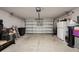 Spacious two car garage with a white door provides ample storage space at 12937 Ogden Glade Rd, Dade City, FL 33525