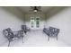 Enclosed patio offers a relaxing space with ceiling fan and decorative furniture at 12937 Ogden Glade Rd, Dade City, FL 33525