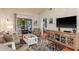 Inviting living room with a cozy atmosphere, view to the patio, and stylish decor at 1380 Azalea Dr # 1701, Dunedin, FL 34698
