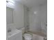 Bright bathroom featuring a tub and shower combination with a modern white vanity at 13907 Fletchers Mill Dr, Tampa, FL 33613