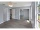 Sunlit bedroom with a ceiling fan, closet with mirrored doors, and a large window at 13907 Fletchers Mill Dr, Tampa, FL 33613