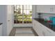 Additional kitchen cabinets provide extra storage with a window offering a pleasant view of outdoors at 13907 Fletchers Mill Dr, Tampa, FL 33613