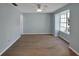 Bright and airy living room with a ceiling fan and large windows at 13907 Fletchers Mill Dr, Tampa, FL 33613