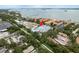 Aerial view of townhomes showcasing the coastal community near the water and local businesses at 1413 Bayshore Blvd # 11, Dunedin, FL 34698