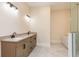 Bathroom with double sink vanity, marble countertops and floors at 1413 Bayshore Blvd # 11, Dunedin, FL 34698