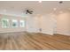 Inviting bedroom featuring wood flooring, large windows and neutral tones for a serene atmosphere at 1413 Bayshore Blvd # 11, Dunedin, FL 34698