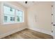 Cozy bedroom showcasing wood flooring, natural light and a fresh, neutral color palette at 1413 Bayshore Blvd # 11, Dunedin, FL 34698
