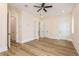 Bright bedroom with hardwood floors, ceiling fan, and white trim at 1413 Bayshore Blvd # 11, Dunedin, FL 34698