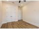 Bedroom with hardwood floors, ceiling fan, and closet at 1413 Bayshore Blvd # 11, Dunedin, FL 34698