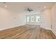 Bright bedroom with wood flooring, large windows and abundant natural light for a fresh ambiance at 1413 Bayshore Blvd # 11, Dunedin, FL 34698