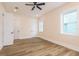 Bright bedroom with hardwood floors and white trim at 1413 Bayshore Blvd # 11, Dunedin, FL 34698
