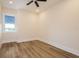 Neutral bedroom with hardwood floors and natural light at 1413 Bayshore Blvd # 11, Dunedin, FL 34698